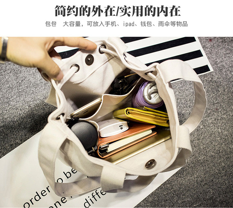 创意拉绳帆布手拎袋大容量，可以放入手机、ipad、钱包、杂志等物品